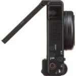 Side view of a compact digital camera with flip-out screen, ideal for vlogging and photography.