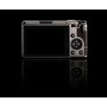 Back view of a compact digital camera with a large display screen.