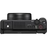 Top view of a compact digital camera with control buttons and lens, available at Camix UK.