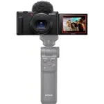 Sony digital camera with flip screen and grip, ideal for vlogging and photography.