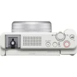 Top view of a compact digital camera with control buttons, ideal for photography enthusiasts.