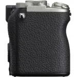 Side view of a compact mirrorless camera body with textured grip.