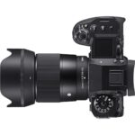 Professional mirrorless camera with Sigma lens, ideal for photography enthusiasts.