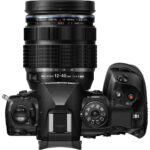 Top view of Olympus mirrorless camera with 12-40mm lens, ideal for photography enthusiasts.