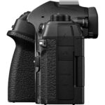 Side view of a professional mirrorless camera body with textured grip and multiple ports.