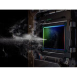 Close-up of a digital camera sensor with dust removal in action.