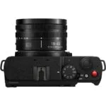 Top view of a Panasonic mirrorless camera with lens, featuring control dials and buttons.