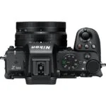 Top view of a Nikon Z 50 II mirrorless camera with lens, showcasing controls and dials.