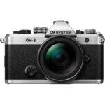 OM System OM-3 mirrorless camera with lens, available at Camix UK.