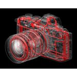 Transparent view of Olympus mirrorless camera with lens, showcasing internal components.
