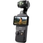 DJI Osmo Pocket handheld camera with screen displaying a landscape view.