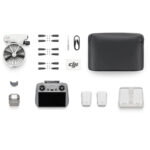 DJI drone with accessories including controller, propellers, and batteries from Camix camera shop UK.