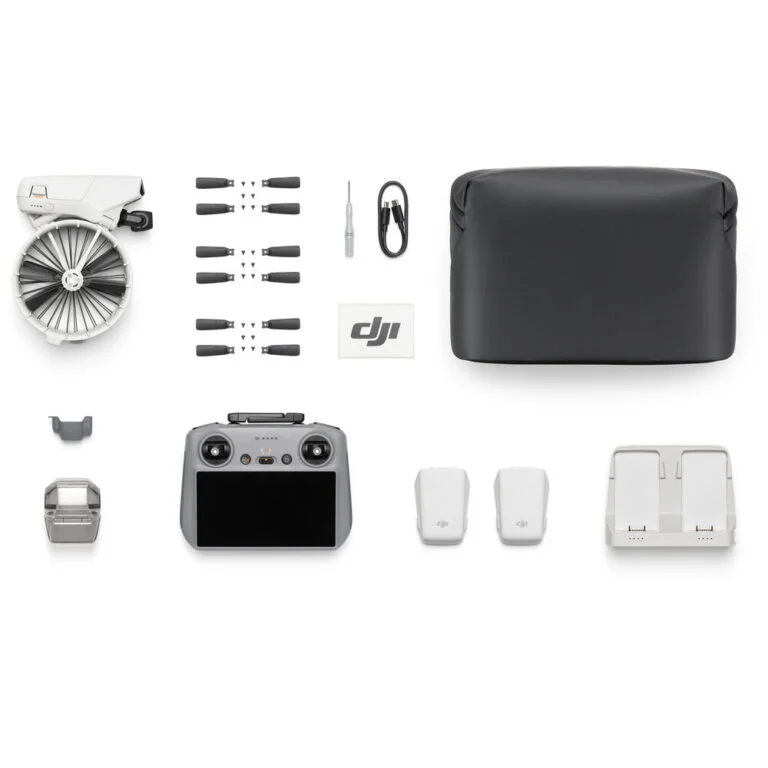 DJI drone with accessories including controller, propellers, and batteries from Camix camera shop UK.