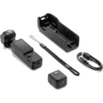 Compact digital camera with accessories including case, strap, and cable on white background.