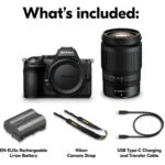 Nikon camera kit with lens, battery, strap, and USB cable.