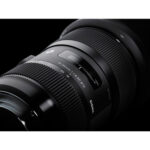 Close-up of a Sigma 18-35mm f/1.8 DC HSM Art lens for digital cameras.