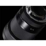 Close-up of a Sigma camera lens, ideal for professional photography and compatible with various camera bodies.
