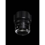 Sigma 24mm f/3.5 DG DN lens for mirrorless cameras on black background.