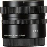 Black camera lens with focus and zoom rings, made in Japan.