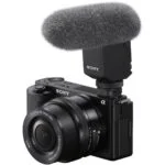 Sony mirrorless camera with microphone, ideal for video and photography.