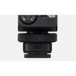 Close-up of a camera accessory with adjustment dial, suitable for various camera models.