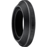 Close-up of a black camera lens adapter ring for photography equipment.