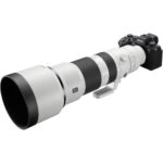 Sony mirrorless camera with a large telephoto lens, ideal for professional photography.