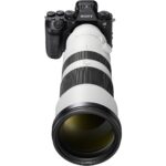 Sony mirrorless camera with telephoto lens, ideal for professional photography.