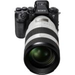 Sony mirrorless camera with large lens, ideal for professional photography.