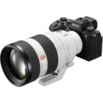 Sony mirrorless camera with telephoto lens, ideal for professional photography.