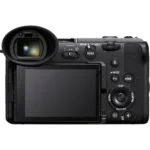 Back view of a digital mirrorless camera with LCD screen and controls.