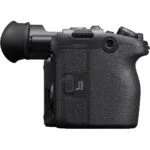 Side view of a professional mirrorless camera body with textured grip.