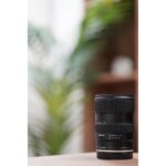 Tamron 35-150mm f/2.8 lens on a table in a camera shop, UK.