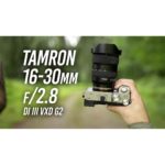 Tamron 16-30mm F/2.8 lens held outdoors, ideal for wide-angle photography.