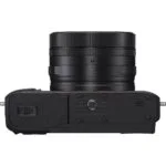 Compact digital camera body with lens, ideal for photography enthusiasts.