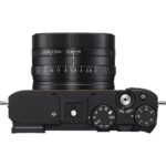 Top view of a compact digital camera with control dials, available at a UK camera shop.