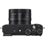 Top view of a compact digital camera with control dials, available at a UK camera shop.