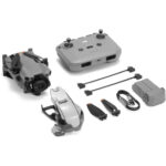 DJI drone with controller, battery, propellers, and accessories from Camix camera shop UK.