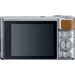 Back view of a compact digital camera with a large screen and control buttons.