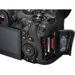 Close-up of a professional camera with dual memory card slots, showcasing photography equipment.