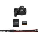 Canon EOS R6 Mark III camera body with battery, charger, and strap.