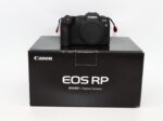 Canon EOS RP mirrorless camera on box, available at UK camera shop.