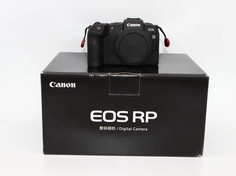 Canon EOS RP mirrorless camera on box, available at UK camera shop.
