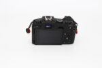 Back view of a digital camera body with LCD screen and controls, available at Camix UK.