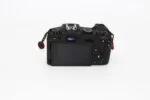 Back view of a digital camera body with LCD screen and controls, available at Camix UK.