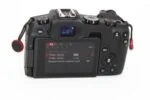 Back view of a digital camera with settings displayed on the screen, available at Camix camera shop UK.