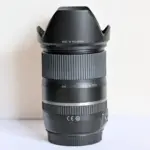 Tamron camera lens with hood, ideal for DSLR and mirrorless cameras, available at Camix UK.