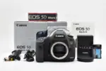 Canon EOS 5D Mark III camera body with accessories and packaging.