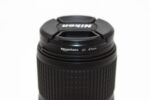 Nikon camera lens with AmazonBasics UV filter, 67mm