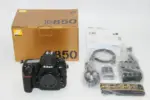 Nikon D850 DSLR camera with accessories and box on display.